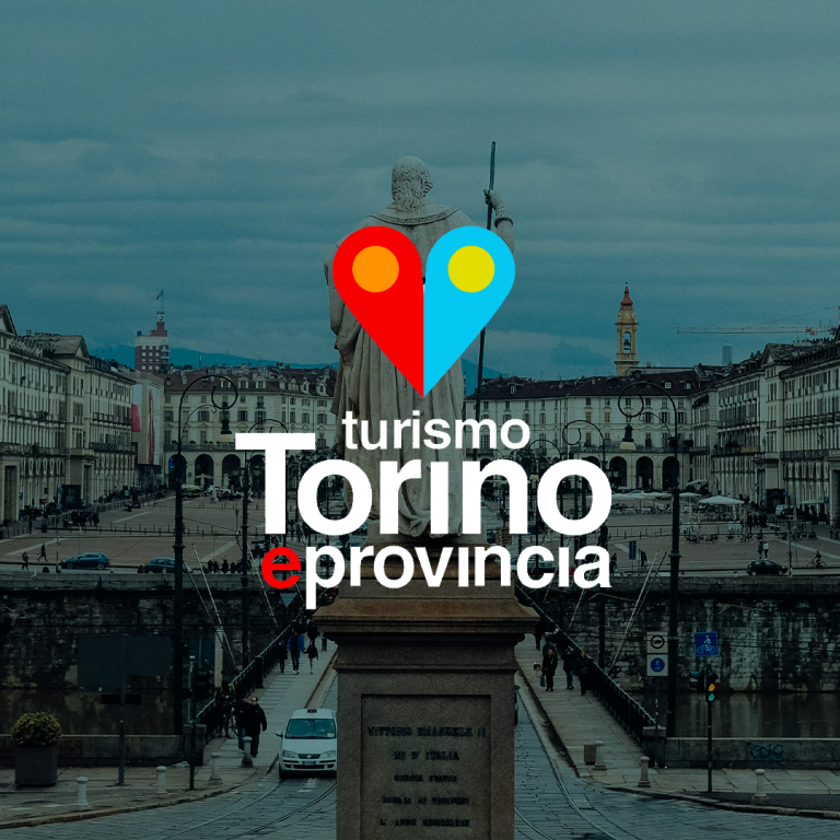A statue stands in the forefront with its back to the camera, overlooking a historic city square in Turin, Italy. The square is surrounded by classic buildings. "Turismo Torino e provincia" is centered on the image with a heart-shaped design above it, inviting tourists to capture their moments on TikTok.