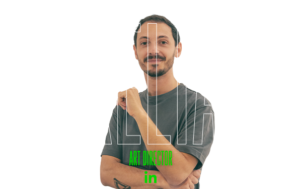 Uomo sorridente con baffi, "AURELIANO" e Art Director alle spalle.